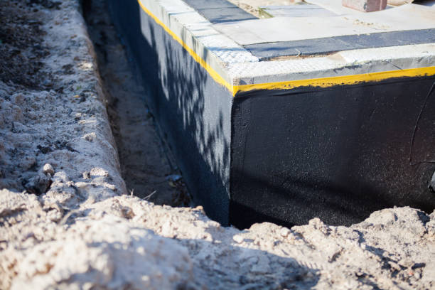 Professional Interior Drainage System technician working in Gambrills, MD